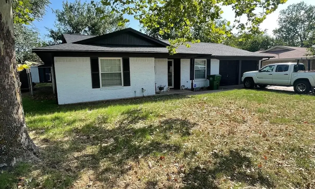 Professional roofing crew working on a residential roof in Tuckahoe